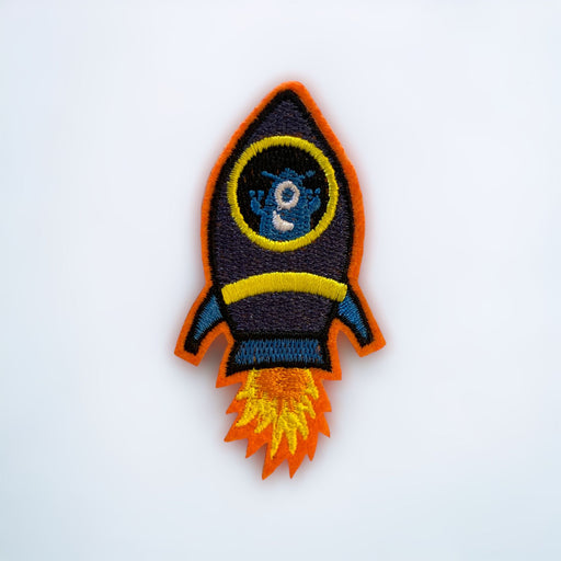 A colorful embroidered patch with a red