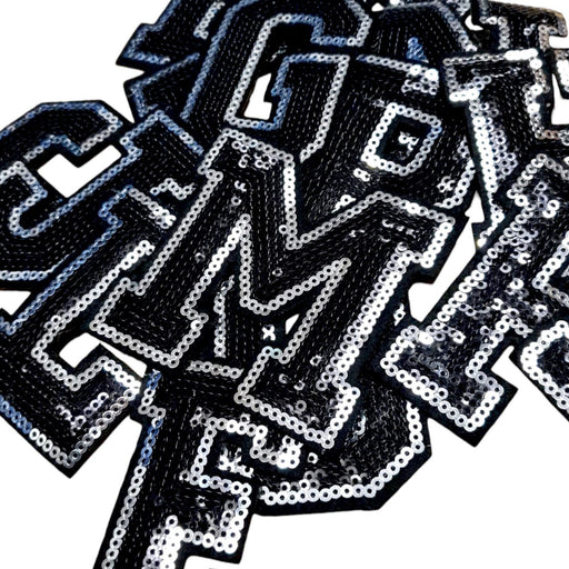 Black and Silver sequin iron on patch letters close up various letters