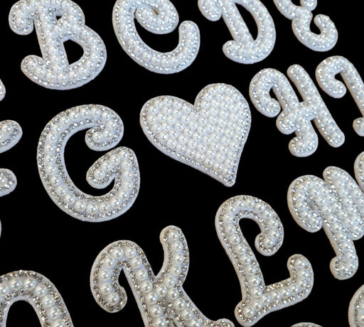 Beautiful quality cursive font white pearl and silver rhinestone iron-on patch letters. These trending pearl patches are also shown with an iron-on heart patch.