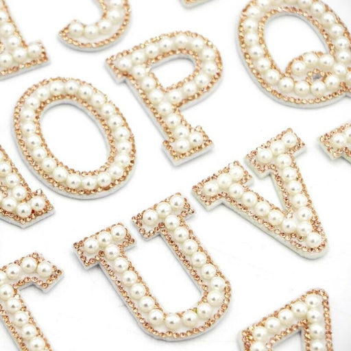 White pearl gold rhinestone iron-on patch letters for brides and personalising clothing.